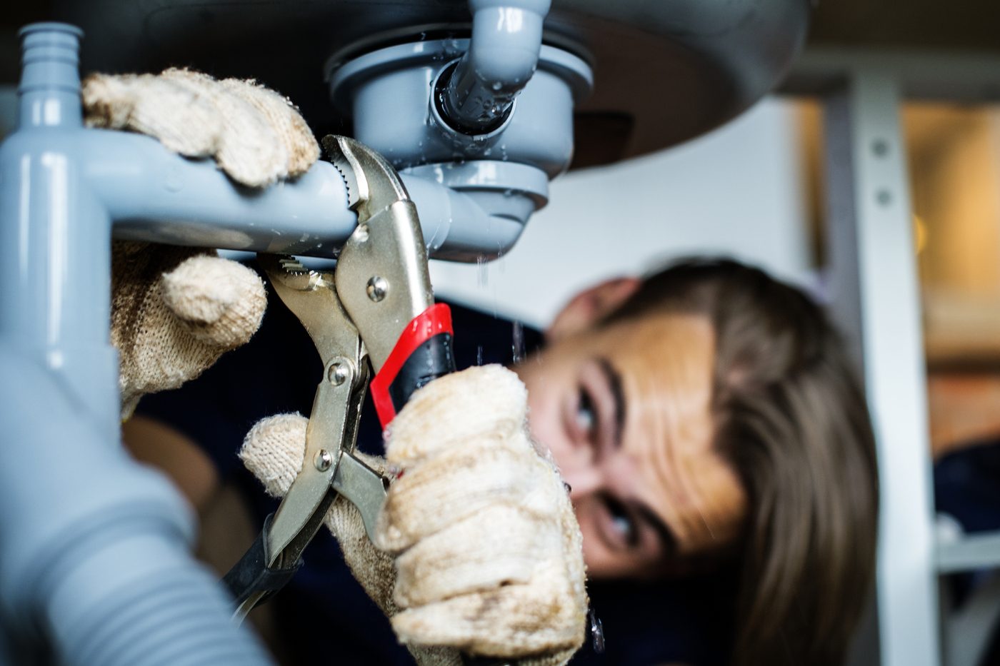 Man fixing kitchen sink
